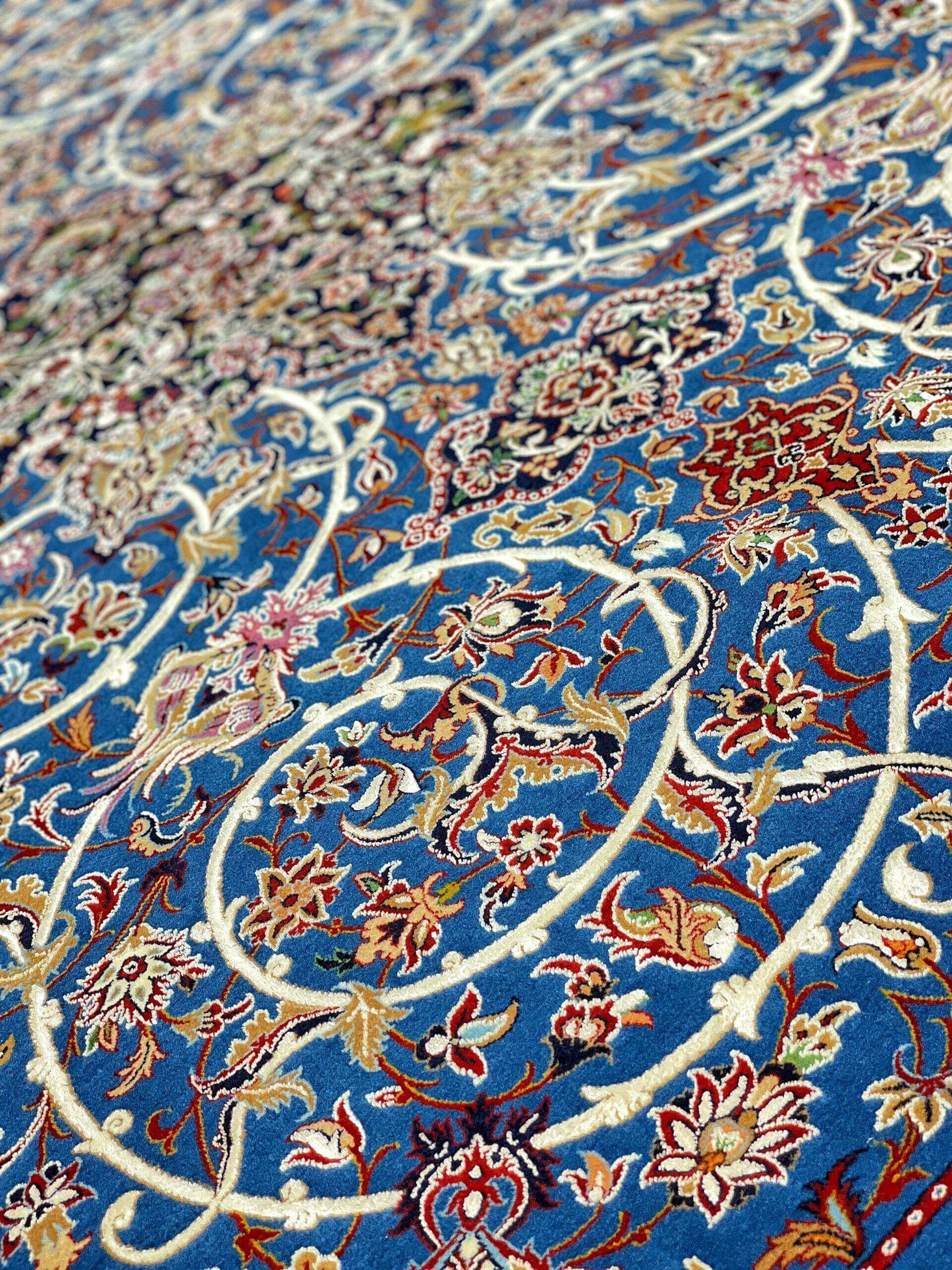 Elegant Bagher Seirafian rug with a timeless royal blue base and floral designs.